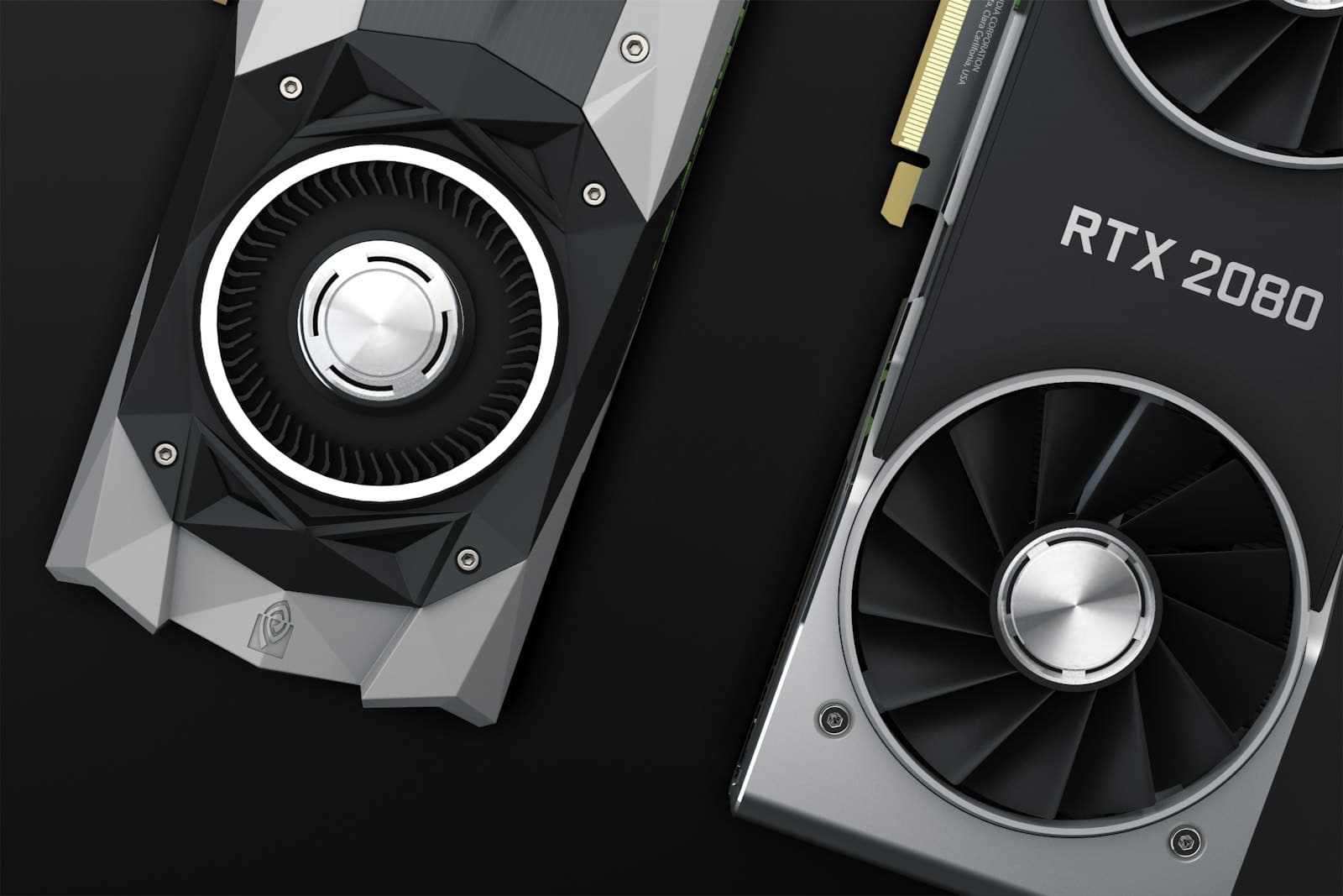 Two NVIDIA graphics cards on a dark surface