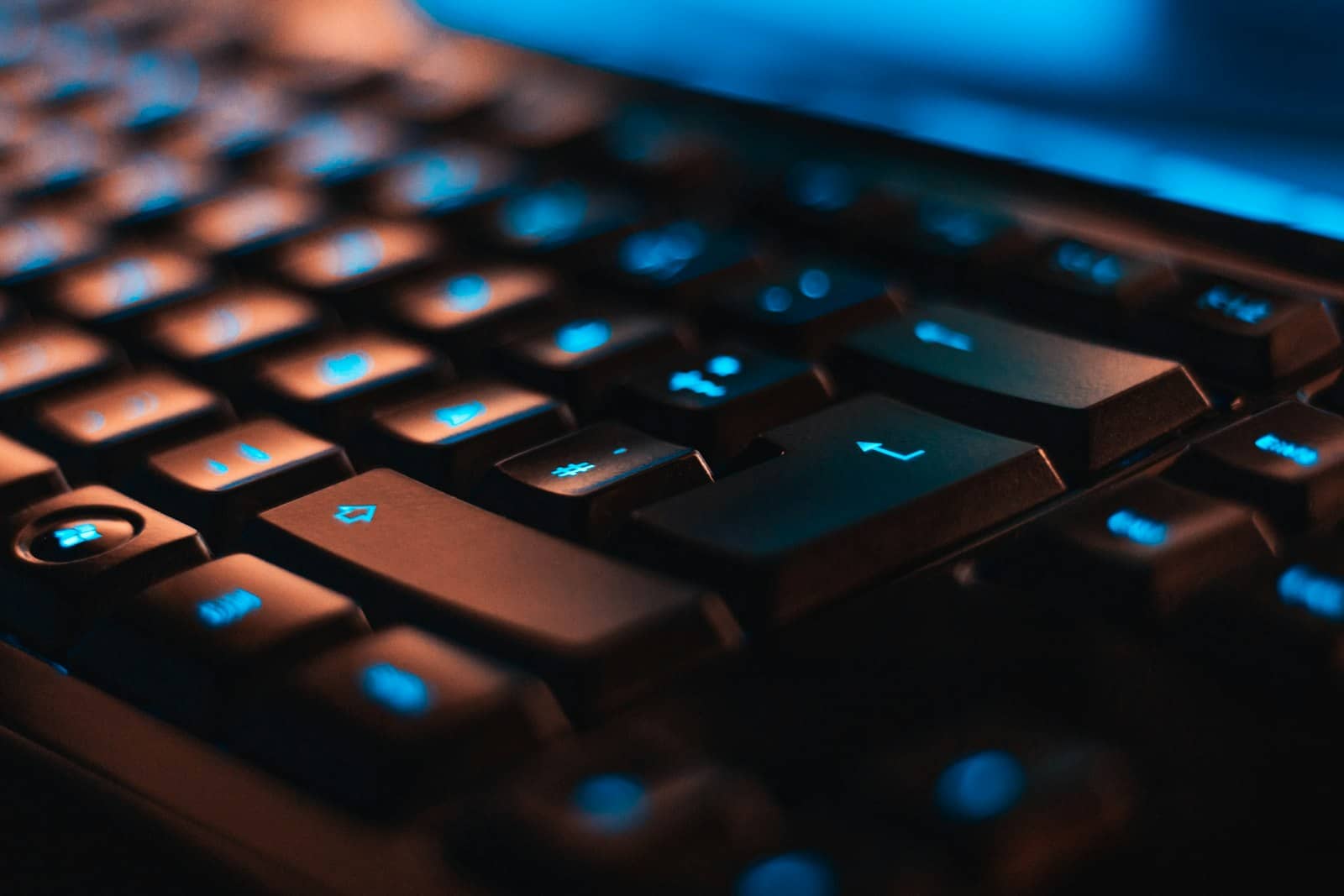A close-up of a backlit mechanical keyboard
