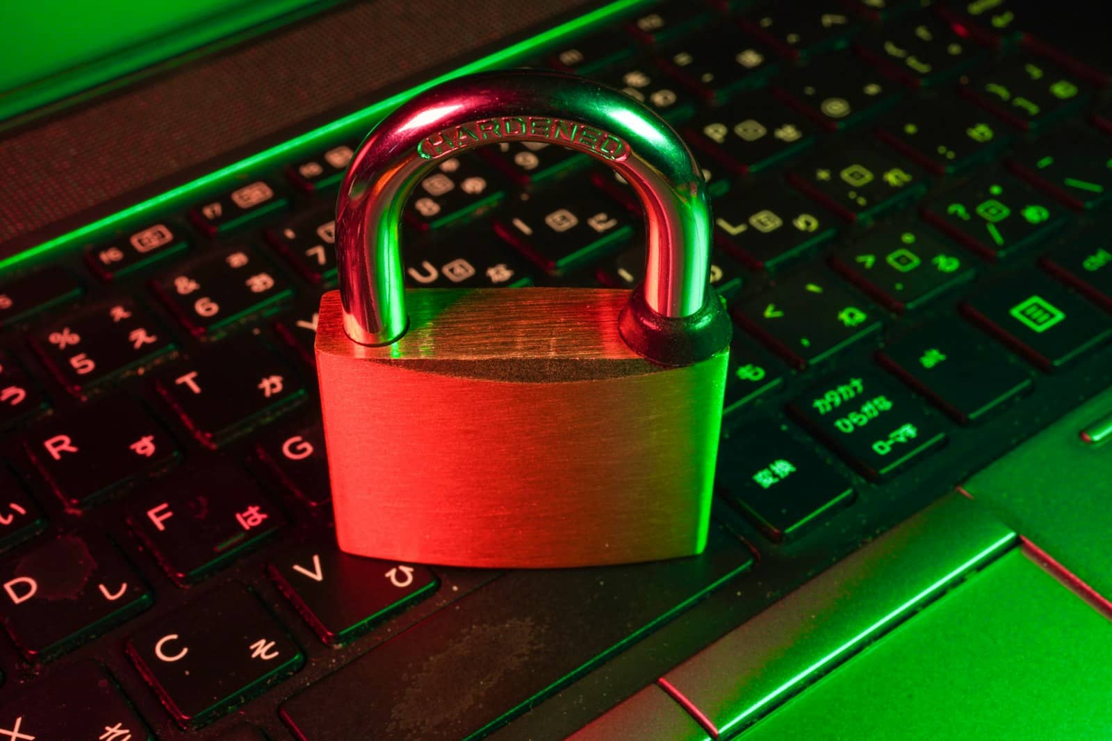 A padlock on a keyboard lit in red and green