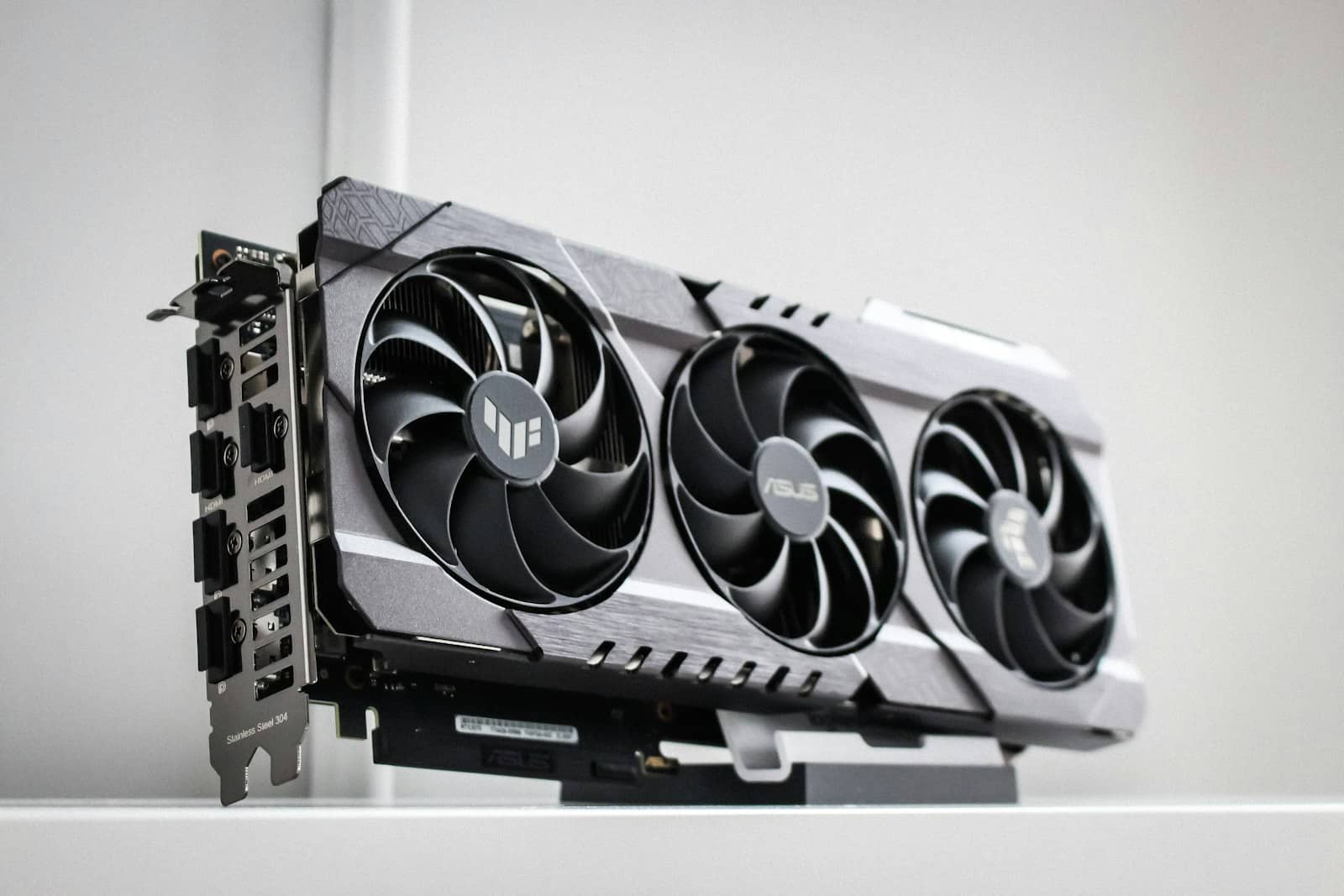 A large triple-fan graphics card on a shelf