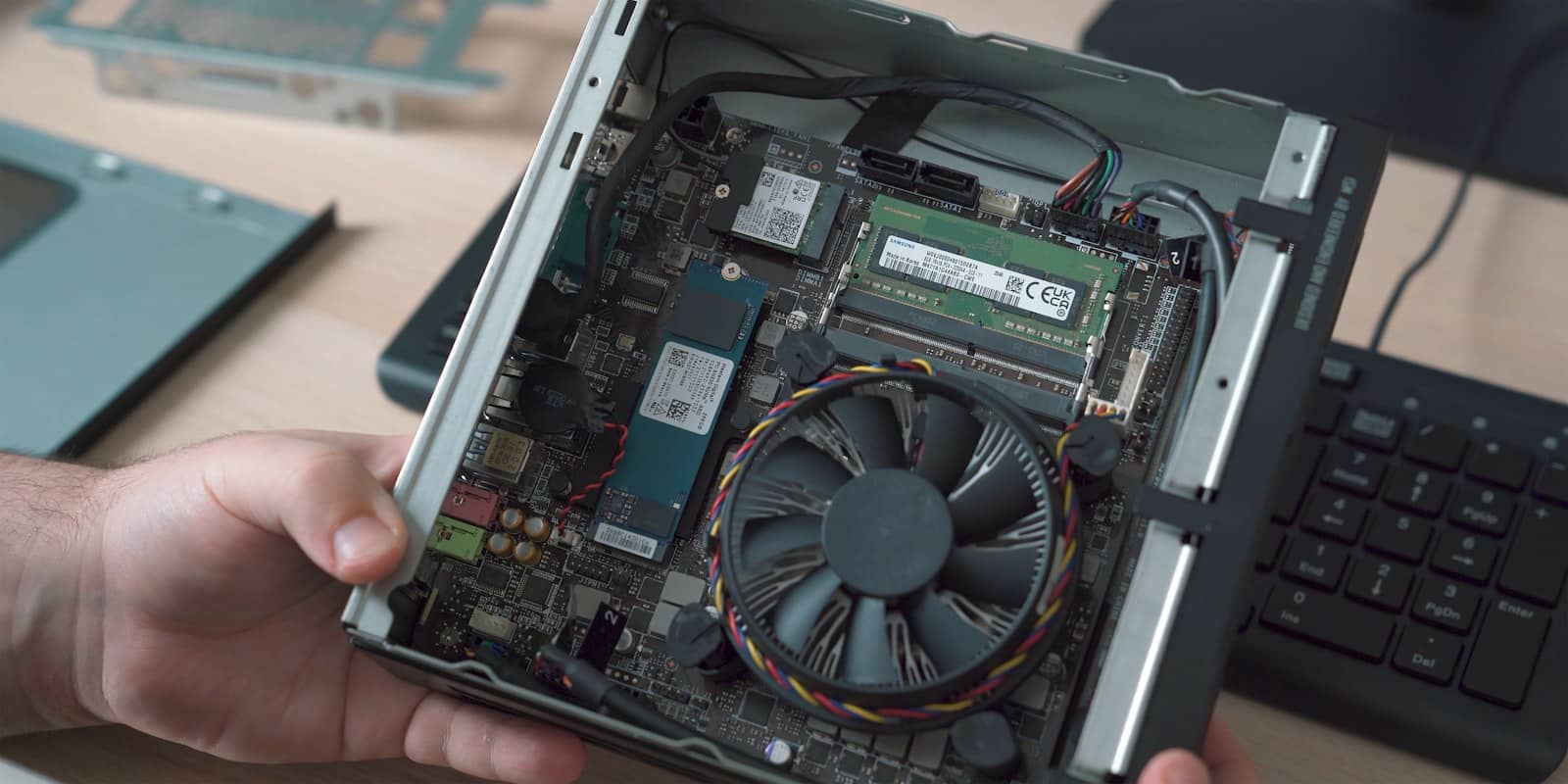 A mini PC opened up showing its internal components