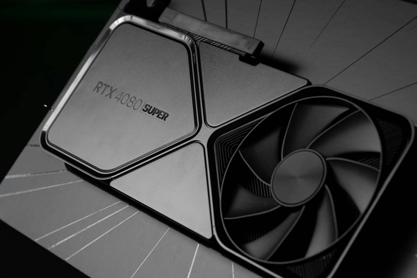 An RTX 4080 Super graphics card on a dark surface