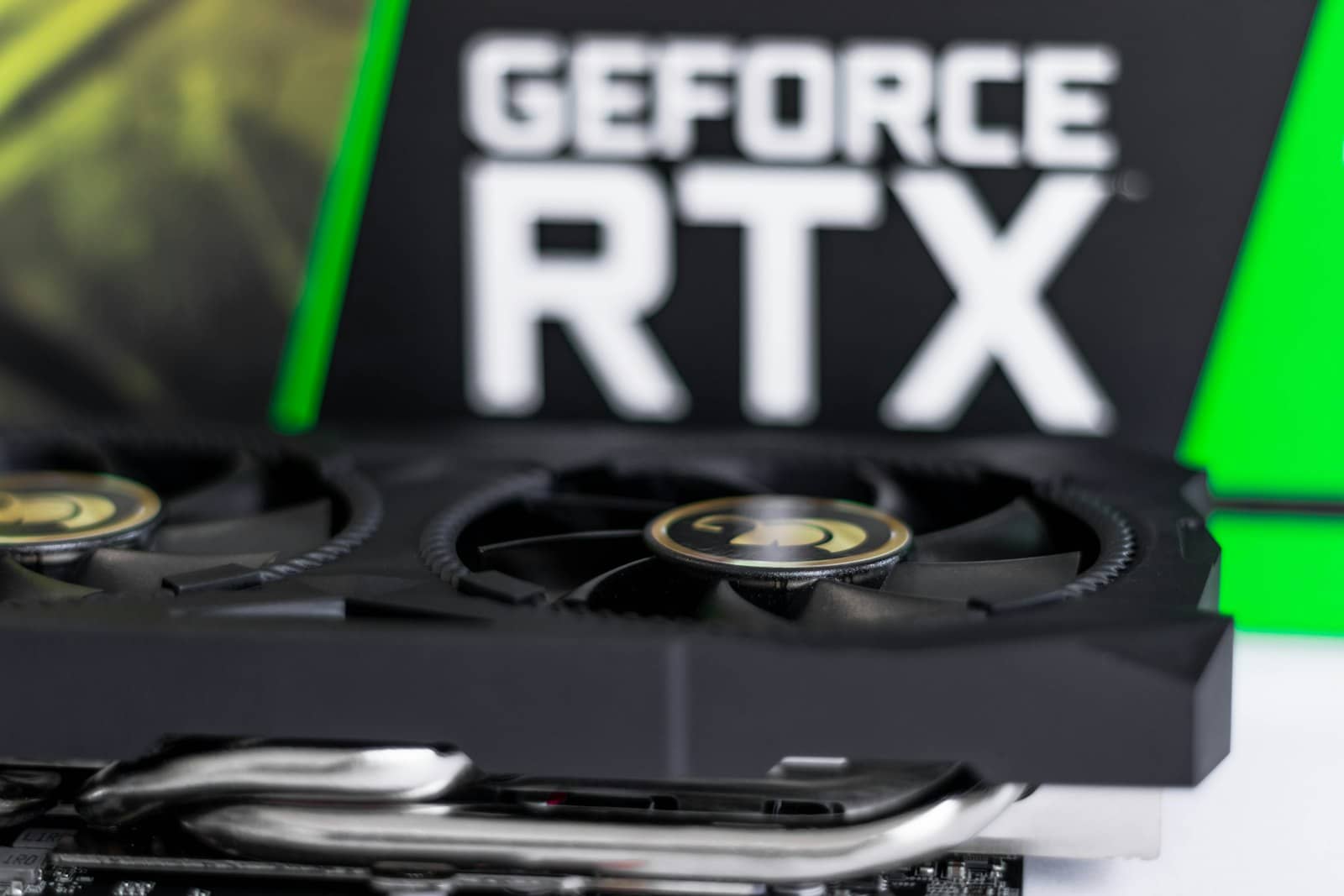 A GeForce RTX graphics card and its retail box