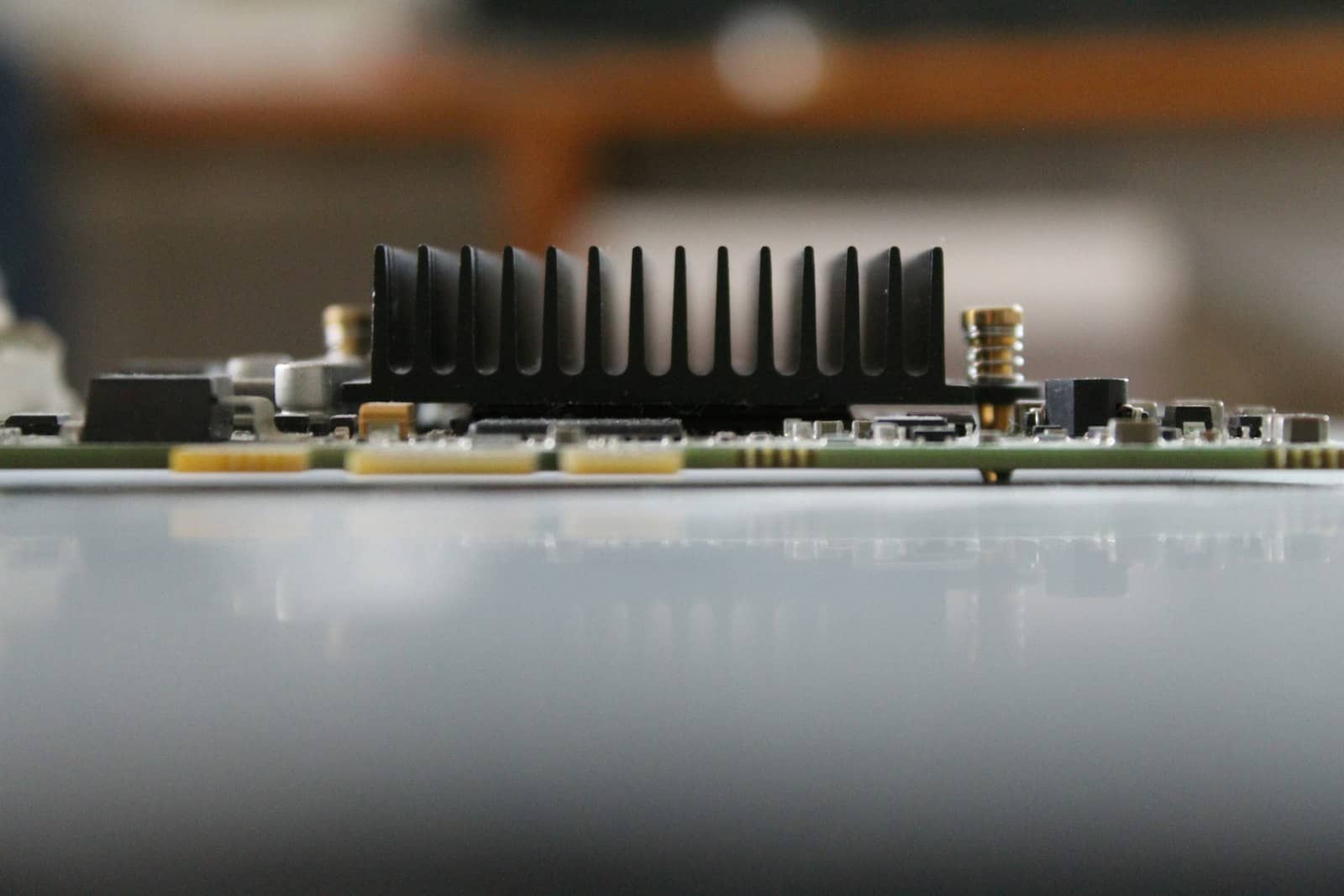 A graphics card PCB with green accents