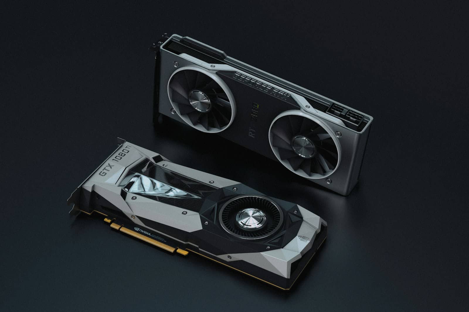 Two graphics cards on a dark surface