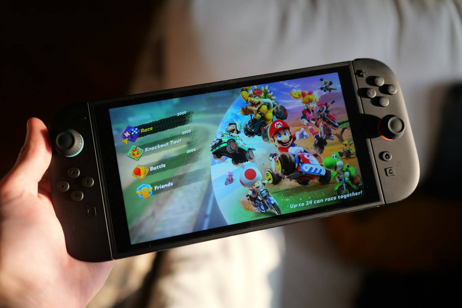 A handheld gaming console being held in two hands