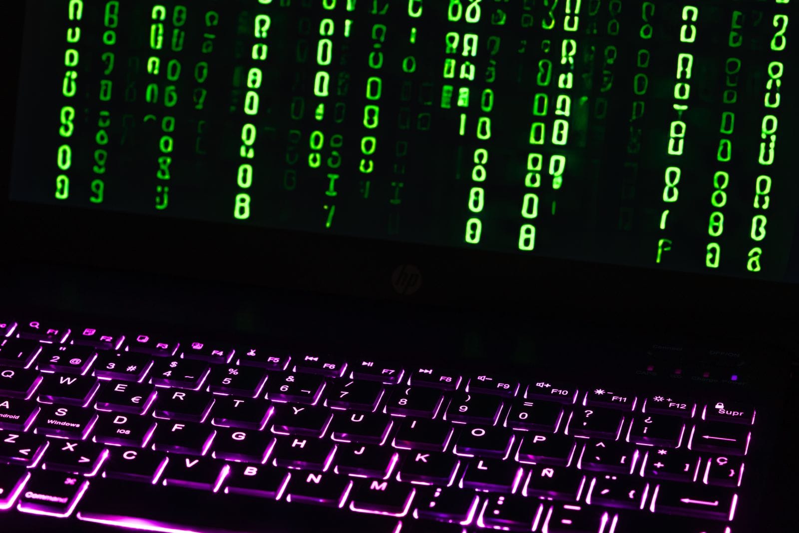 Green code on a laptop screen, evoking a software vulnerability