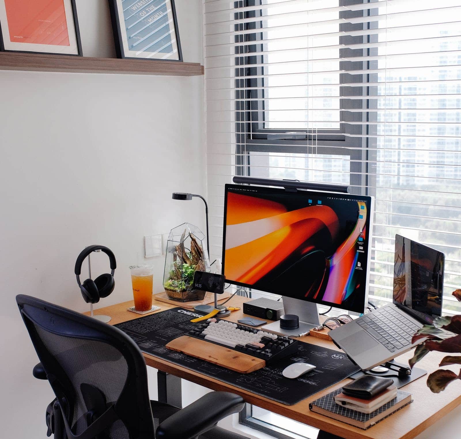 A tidy home-office desk with a compact computer setup
