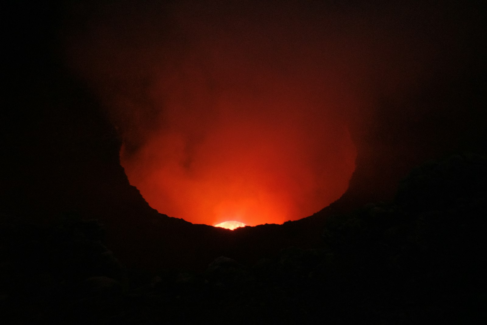 A dark volcanic landscape evoking Doom's hellish setting