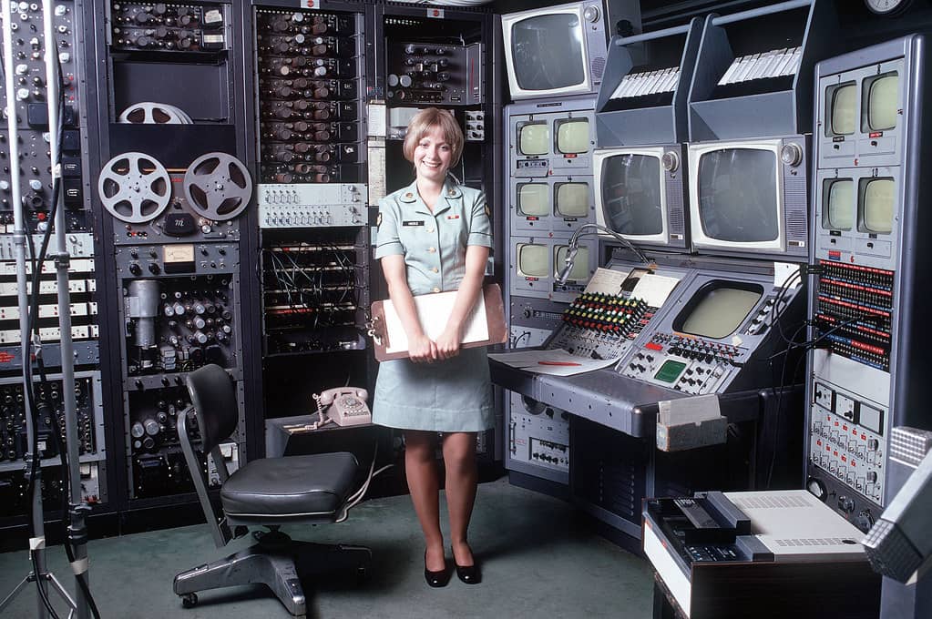 An IT admin working on server hardware, representing the PXE boot and imaging infrastructure exposed by the WDS TFTP vulnerability