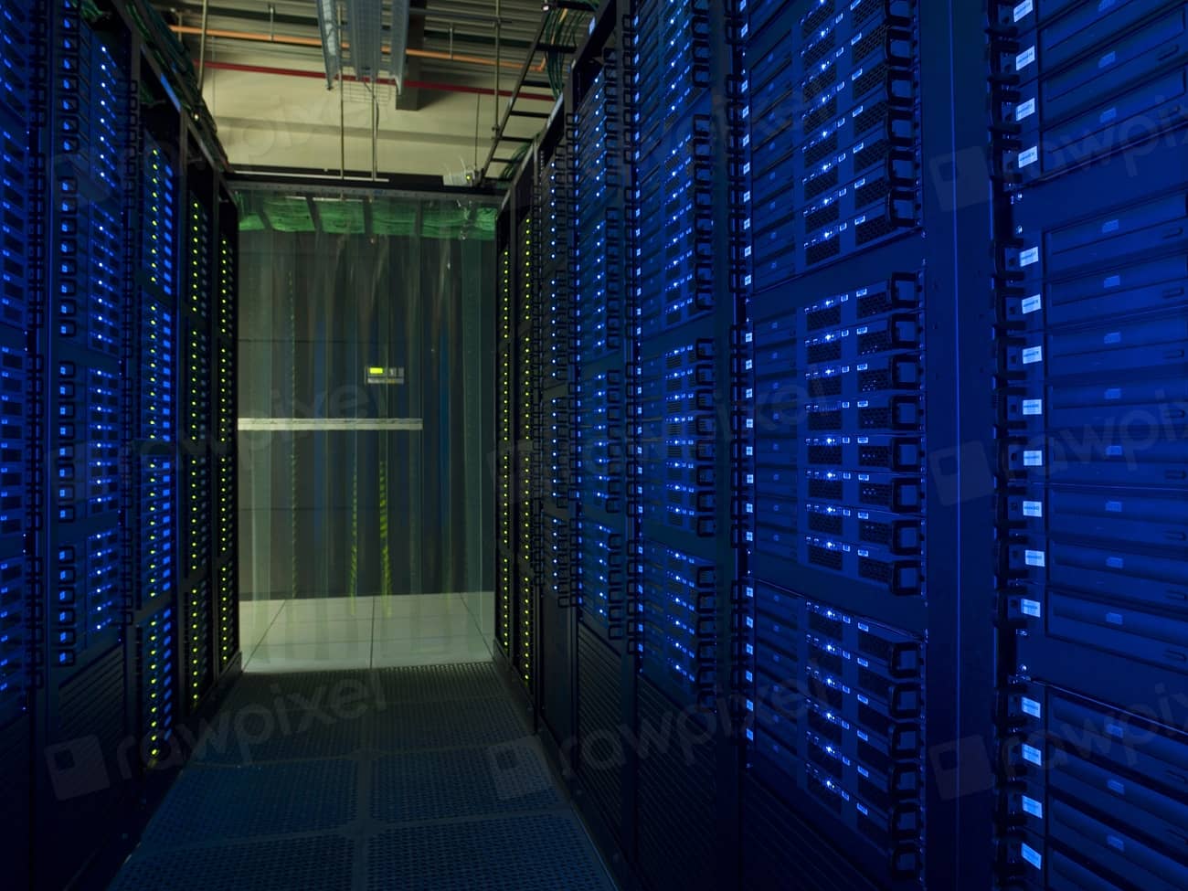 Rows of server racks in a data center lit with blue light