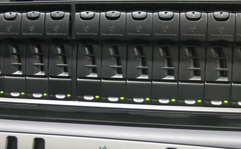 A firewall appliance mounted in a server rack, representative of Fortinet FortiOS/FortiProxy edge devices