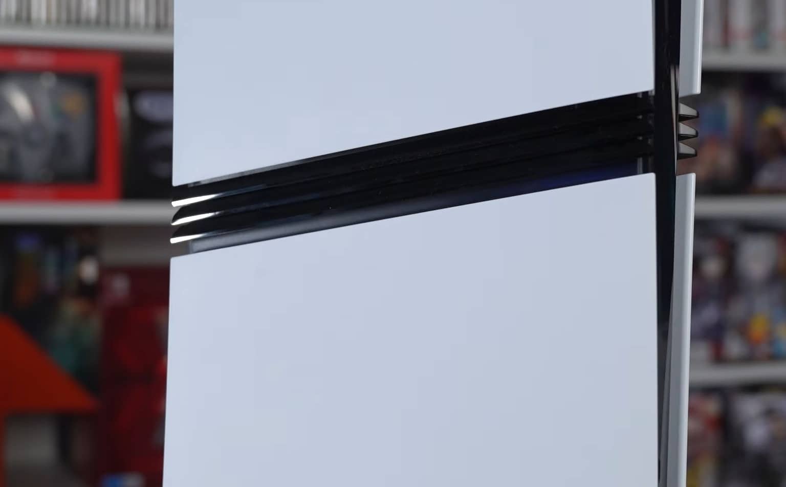 Close-up of a PlayStation 5 console's disc drive slot