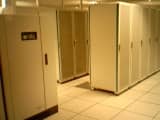Rows of server racks in a data center, representing an on-premises SharePoint deployment