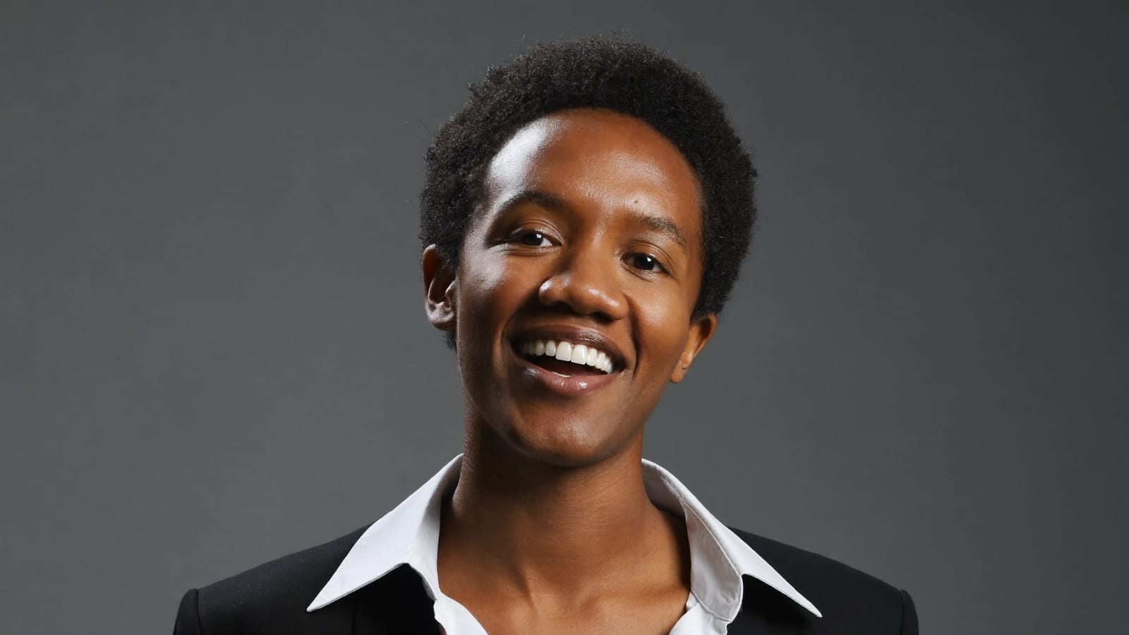 A studio-style presenter headshot, a still from a Higgsfield generation