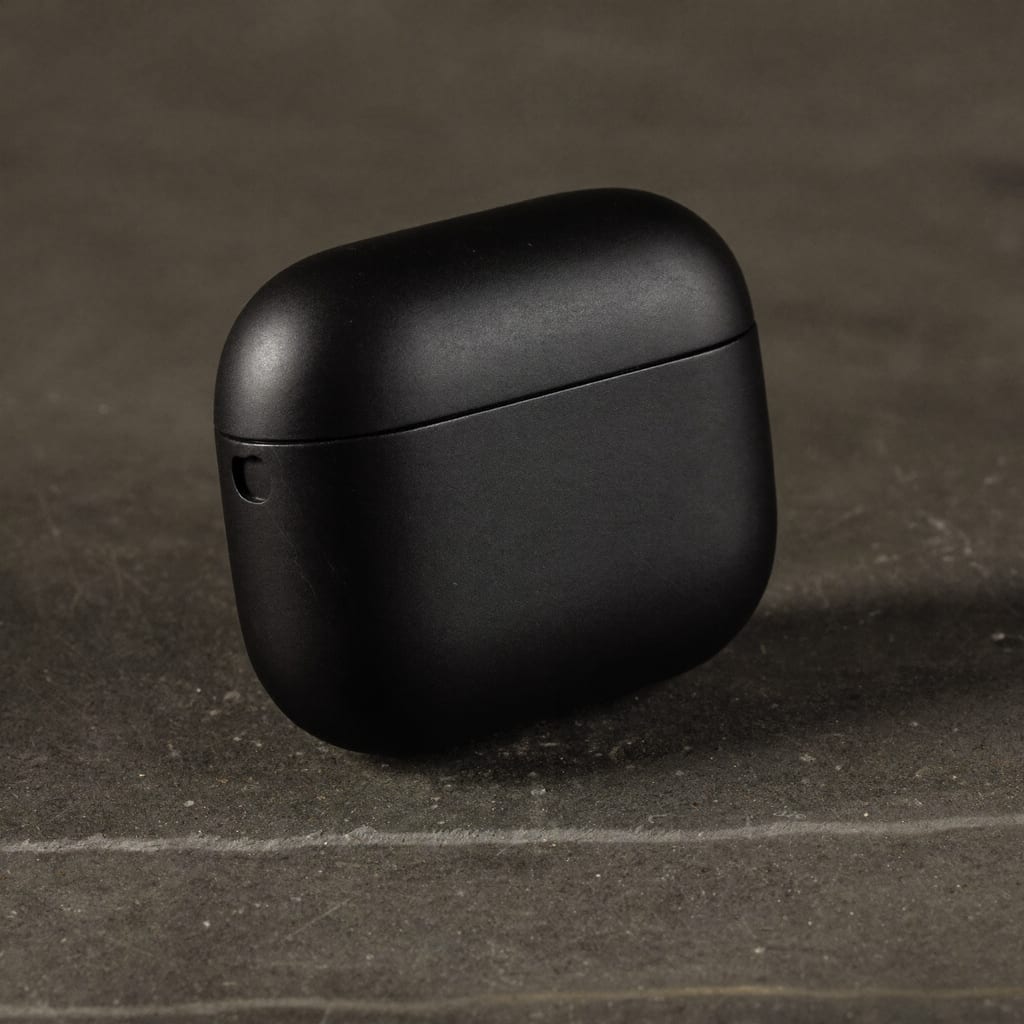 A matte black earbuds case product shot generated with Higgsfield