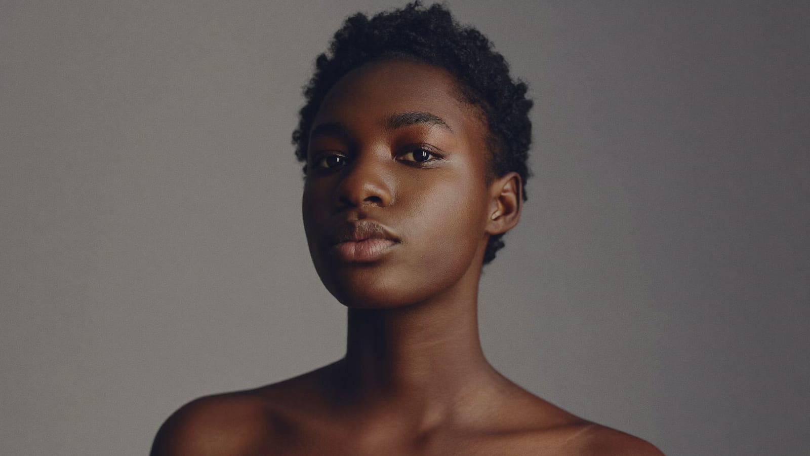 A clean studio portrait of one consistent character