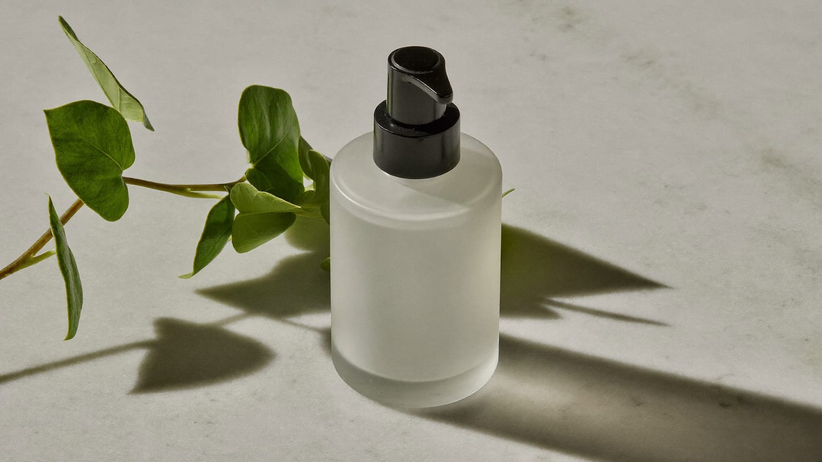 A minimalist skincare serum bottle on marble, a product shot generated with Higgsfield