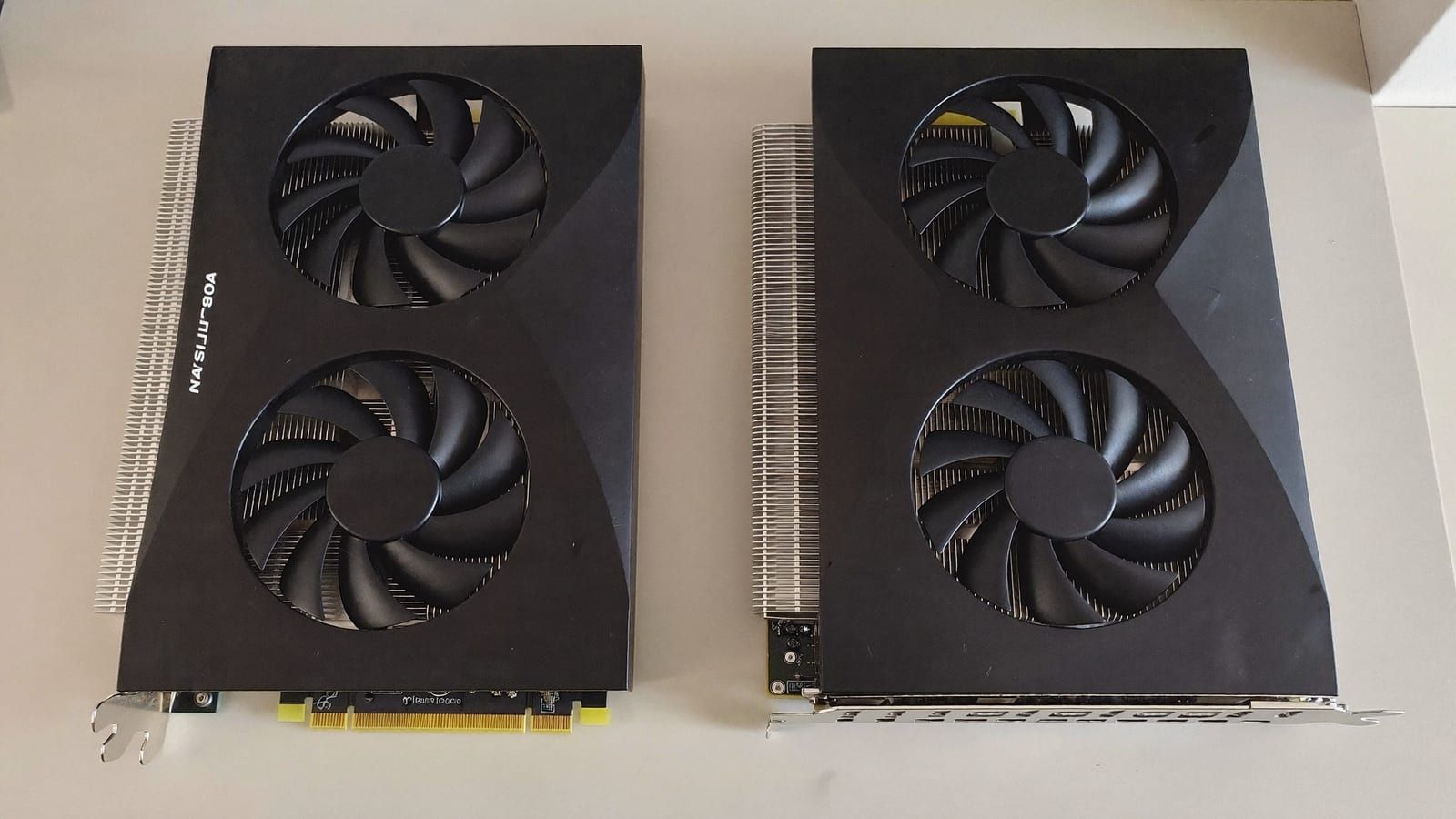 An RTX 5070 and an RX 9070 graphics card side by side