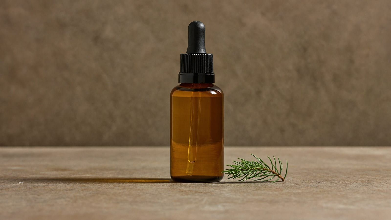 A plain amber dropper bottle on marble with soft studio lighting — an AI-generated e-commerce hero shot