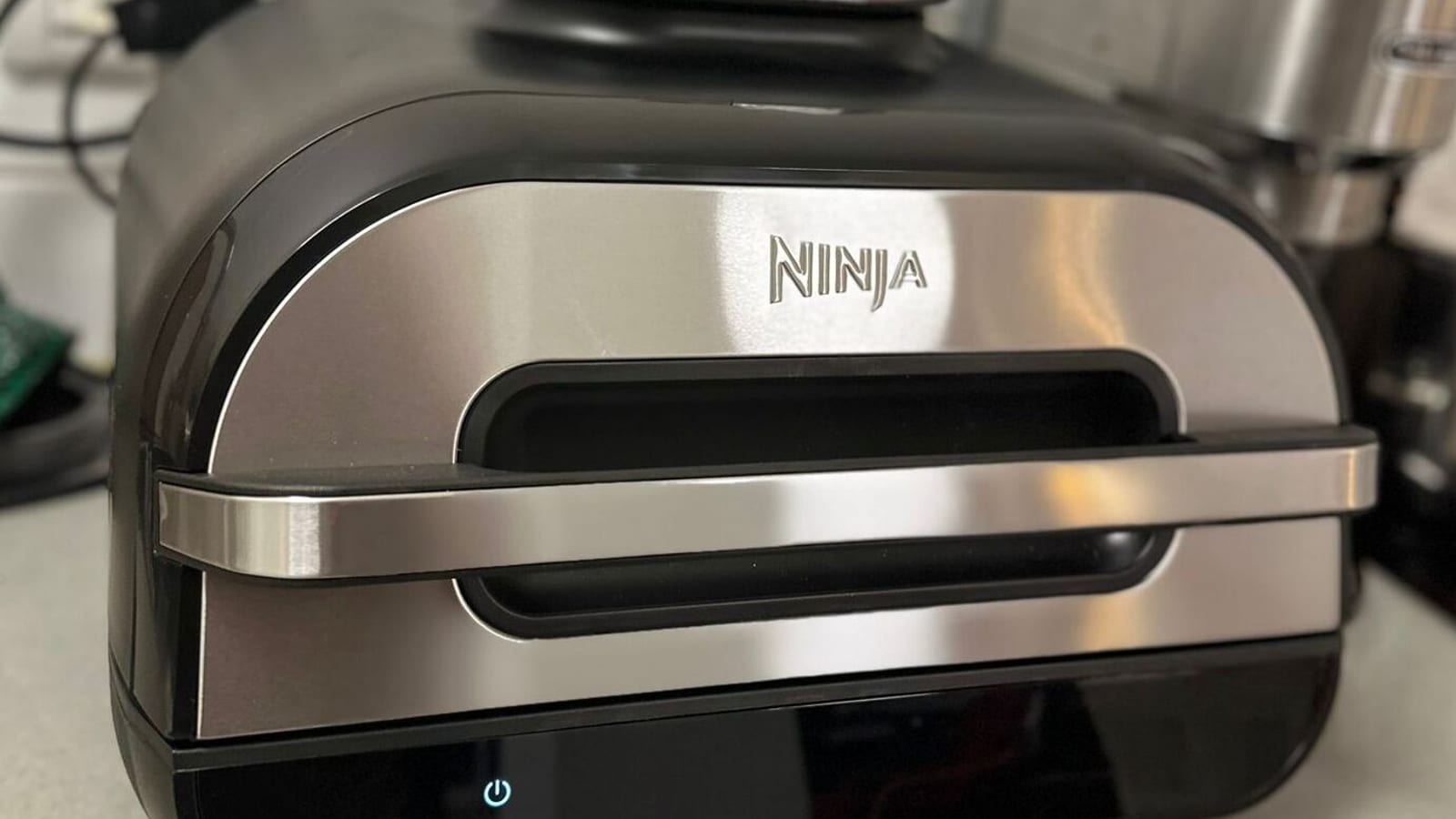 An air fryer on a kitchen counter
