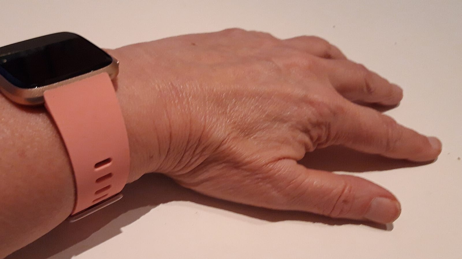 A fitness tracker on a wrist