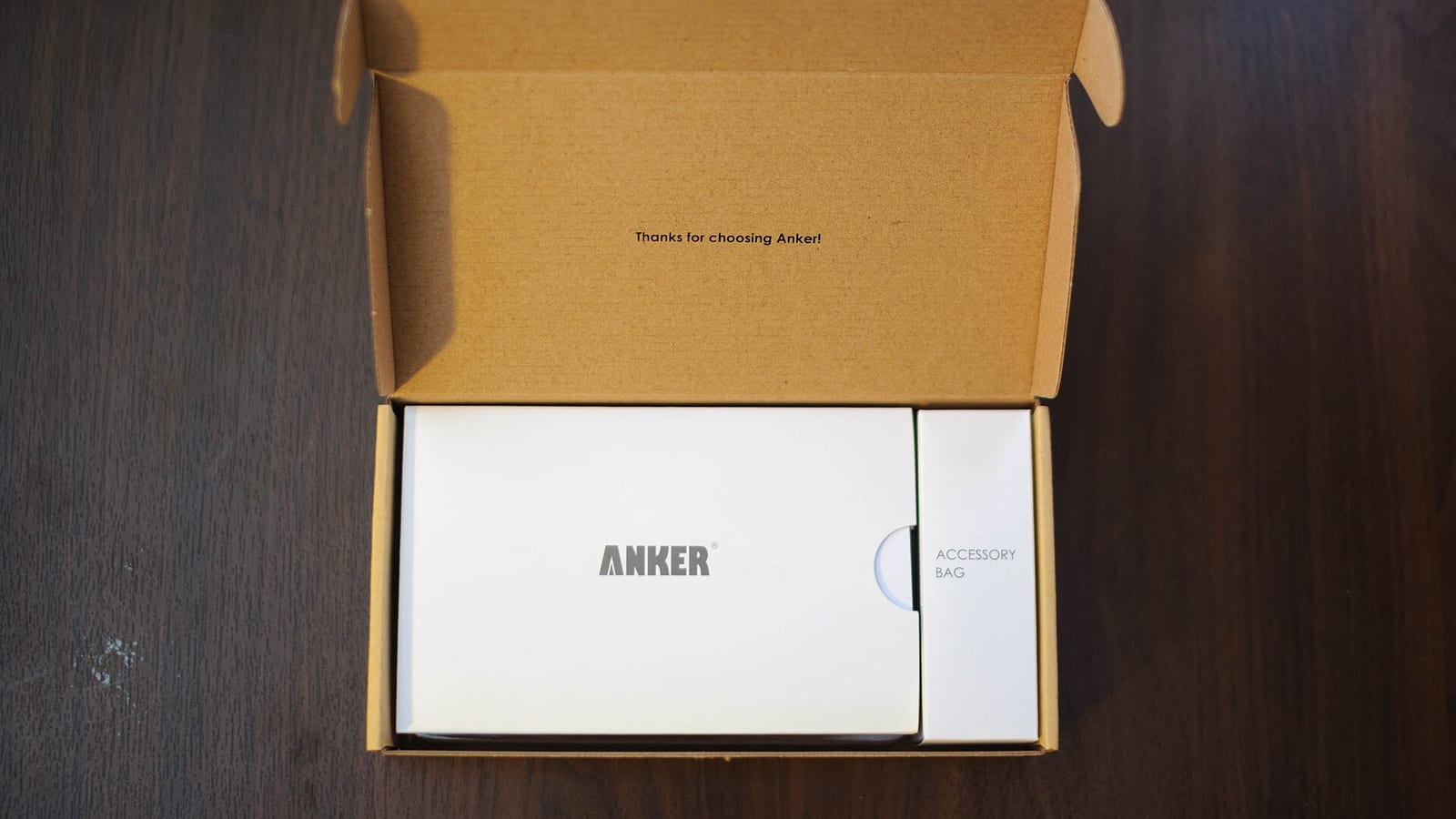 A portable power bank charging a smartphone